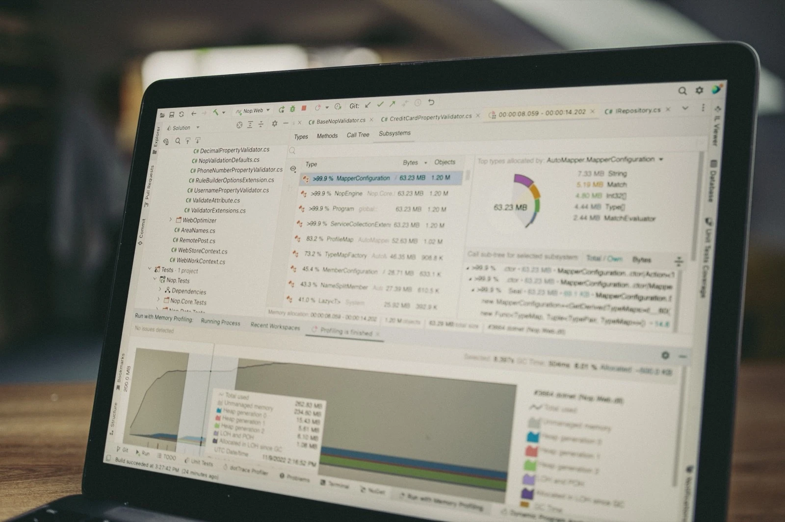 Developer profiling memory usage and performance metrics on a laptop