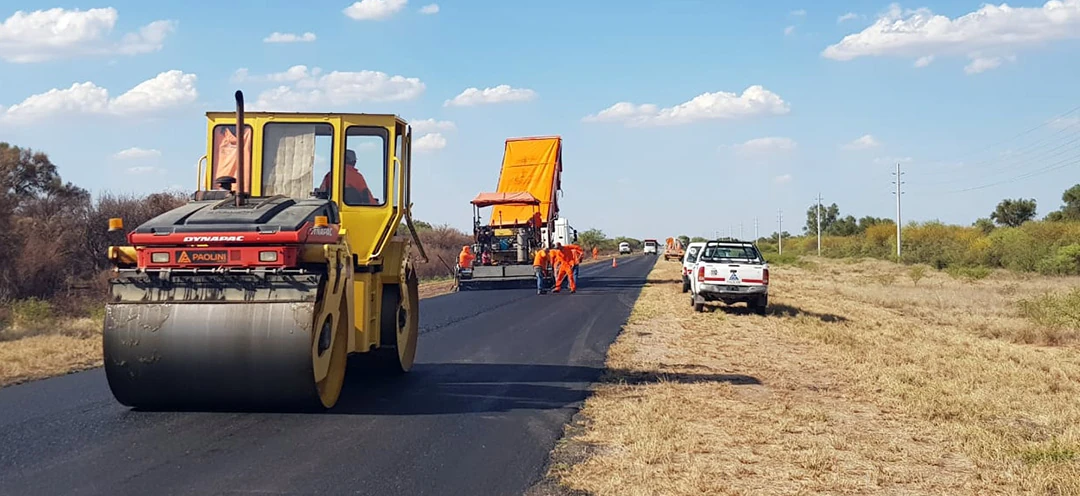 Paolini road paving — Dynapac roller with Paolini branding on asphalt crew